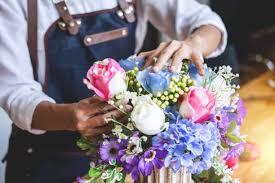 Person arranging flowers
